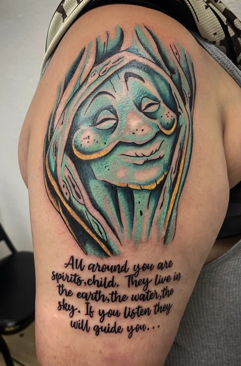 A woman with a face tattoo and a quote.
