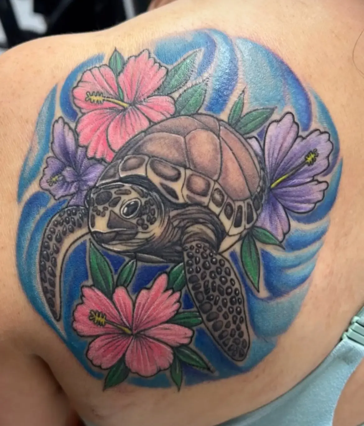 A turtle with flowers on it's back