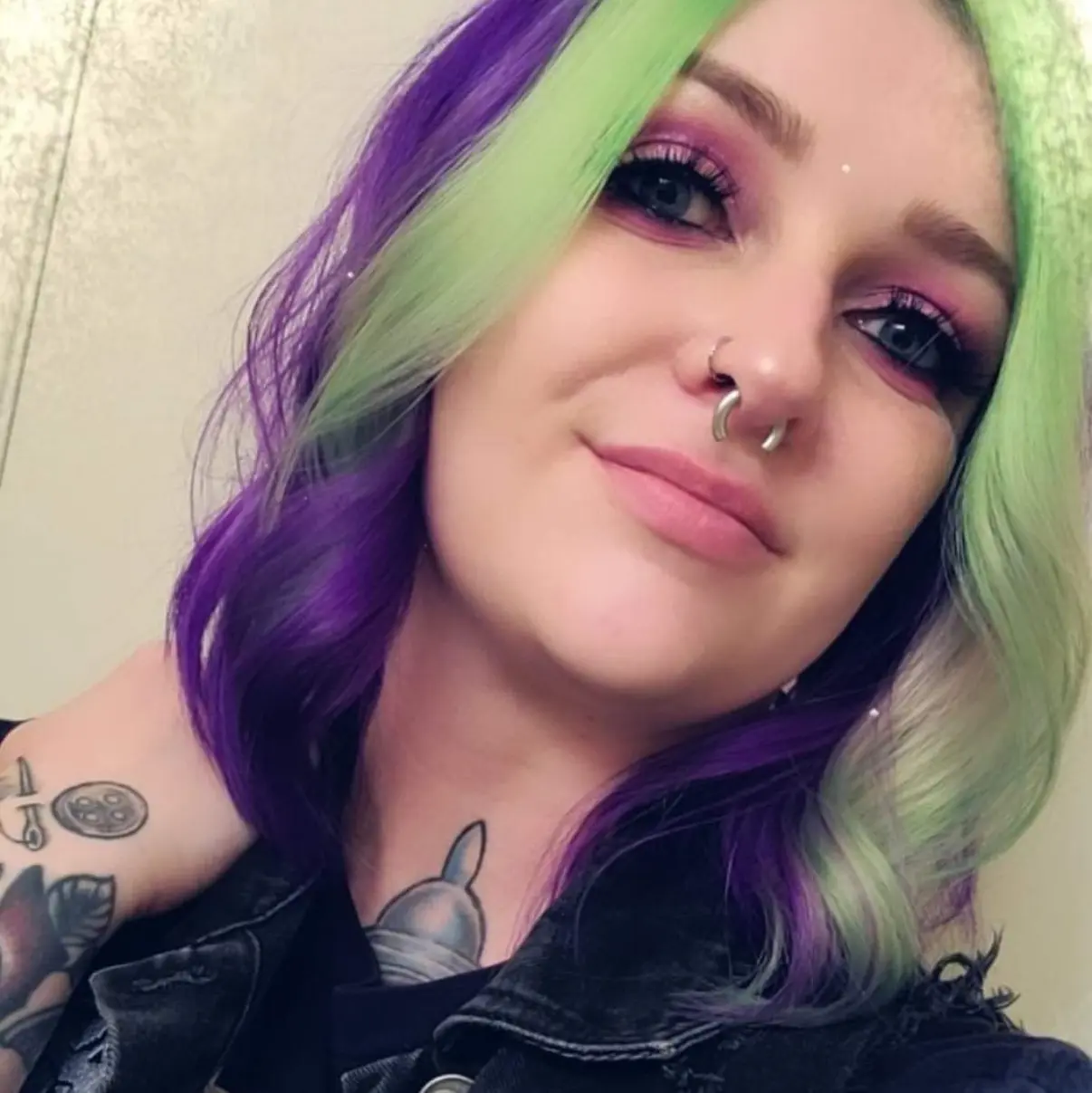 IMG_5592 A woman with purple and green hair.