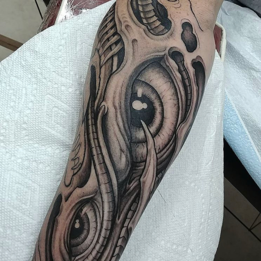 A man with a tattoo on his arm.
